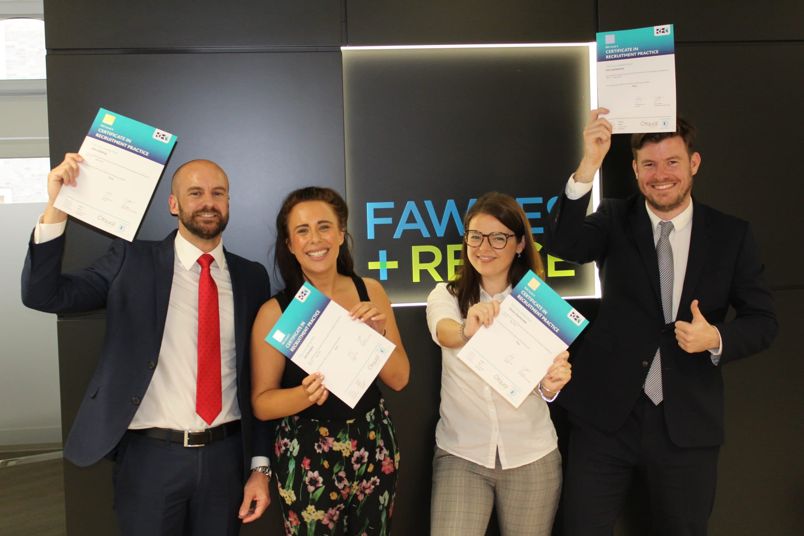 Fawkes & Reece consultants holding their REC qualification certificates