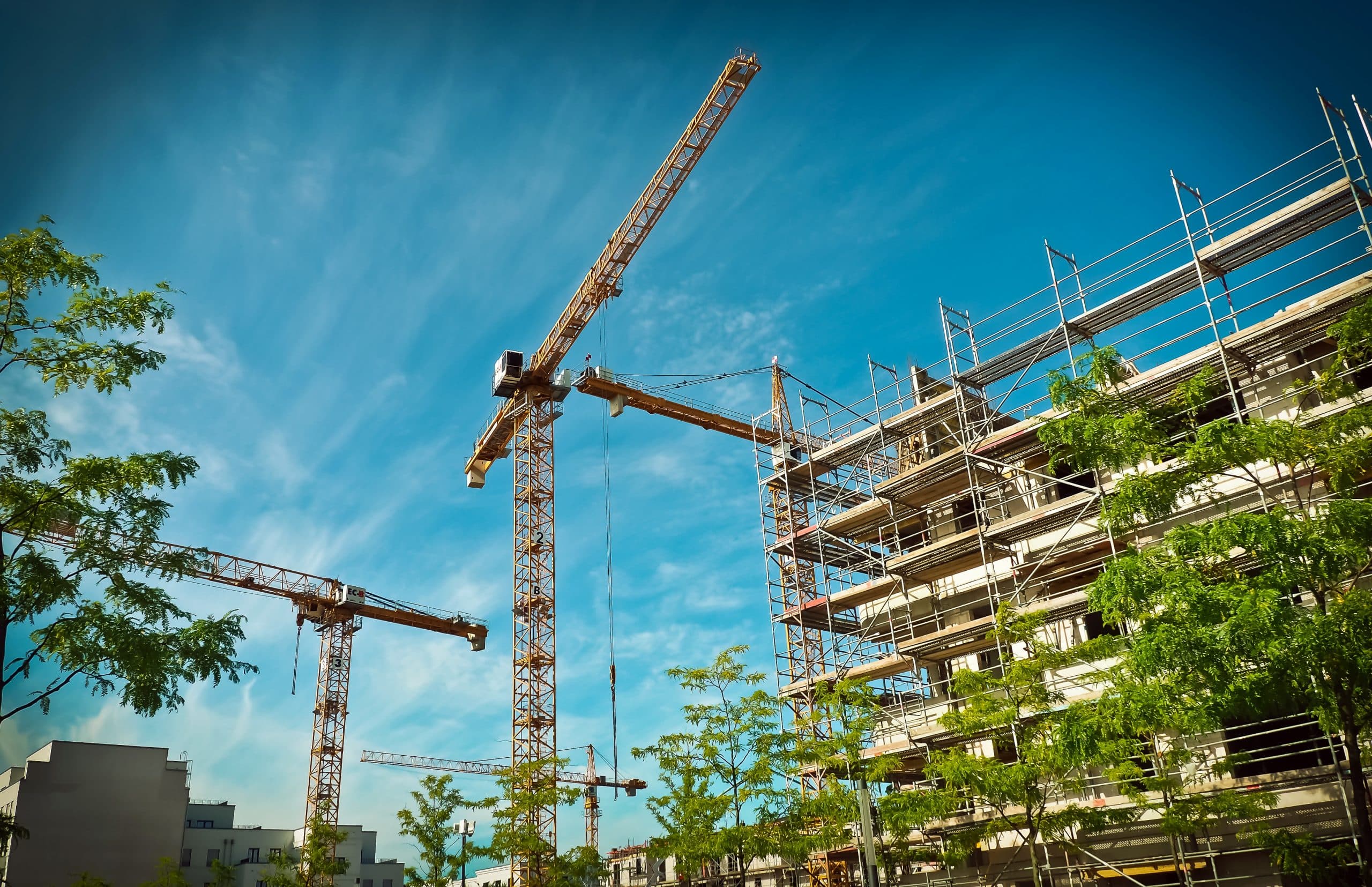 Cranes over a residential scheme under construction